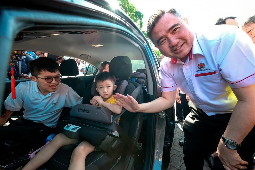 Transport Minister Anthony Loke Siew Fook welcomes road users after launching the national-level Road Safety Campaign and Integrated Ops in conjunction with the Chinese New Year at the Tapah Rest and Recreation area today. - Bernama