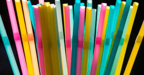 Multiple colours of plastic straws.