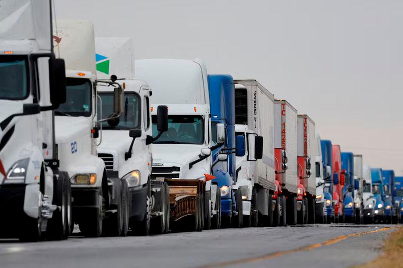 Trucks wait in line to cross into the United States near the border customs control at the World Trade Bridge, in Nuevo Laredo, Mexico - REUTERSpix