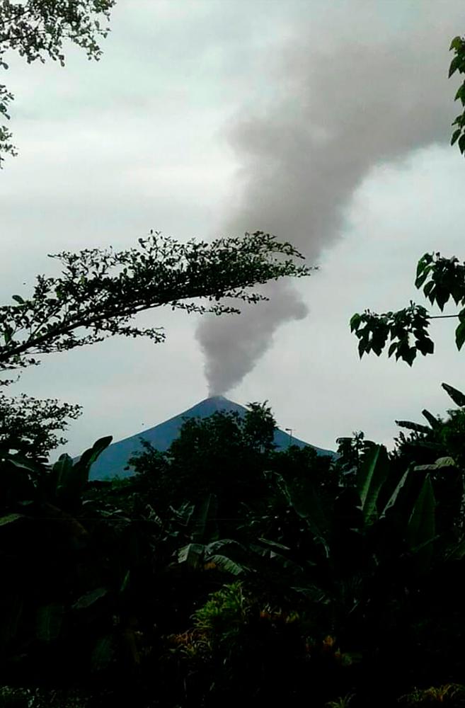 Papua New Guinea’s Mount Ulawun volcano, designated one of the world’s most hazardous, is seen spewing ash on June 26, 2019, prompting authorities to warn of a possible eruption. — AFP