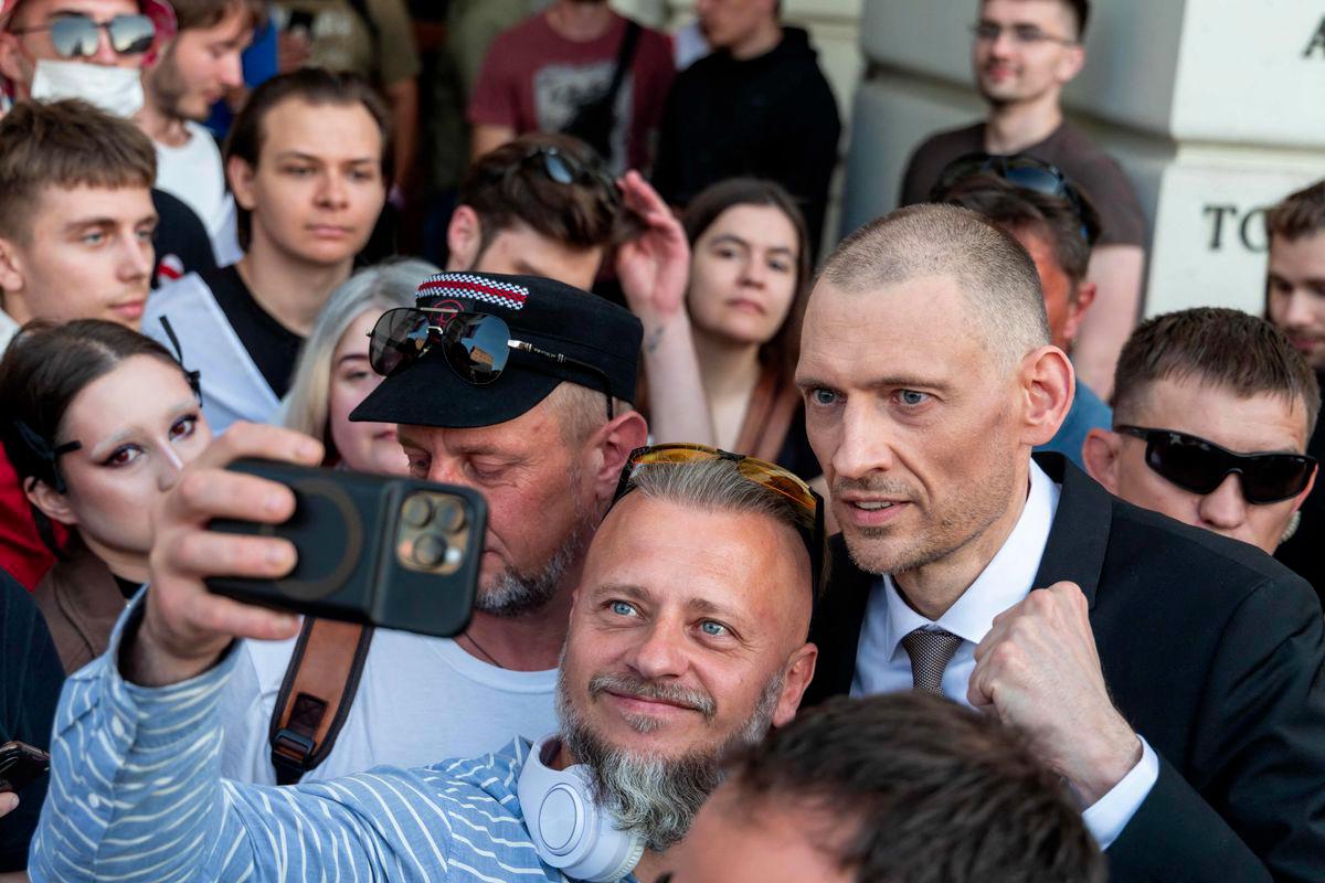 Belarusian oppositionists Sergei Tikhanovsky (R) poses for pictures during a rally organised by Belarusian diaspora in Warsaw, Poland, on June 26, 2025. - AFPPIX