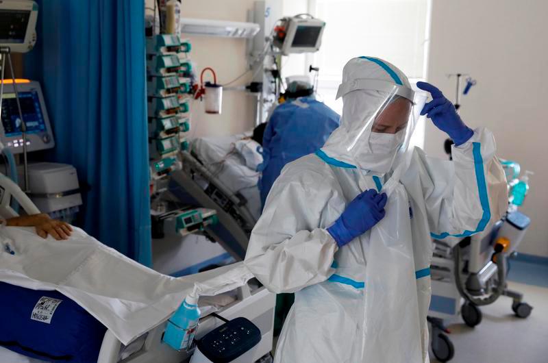 Medical staff treat a patient inside of the extracorporeal membrane oxygenation (ECMO) coronavirus disease ward at the Interior and Administration Ministry (MSWiA) hospital in Warsaw, Poland, March 8, 2021. — Reuters