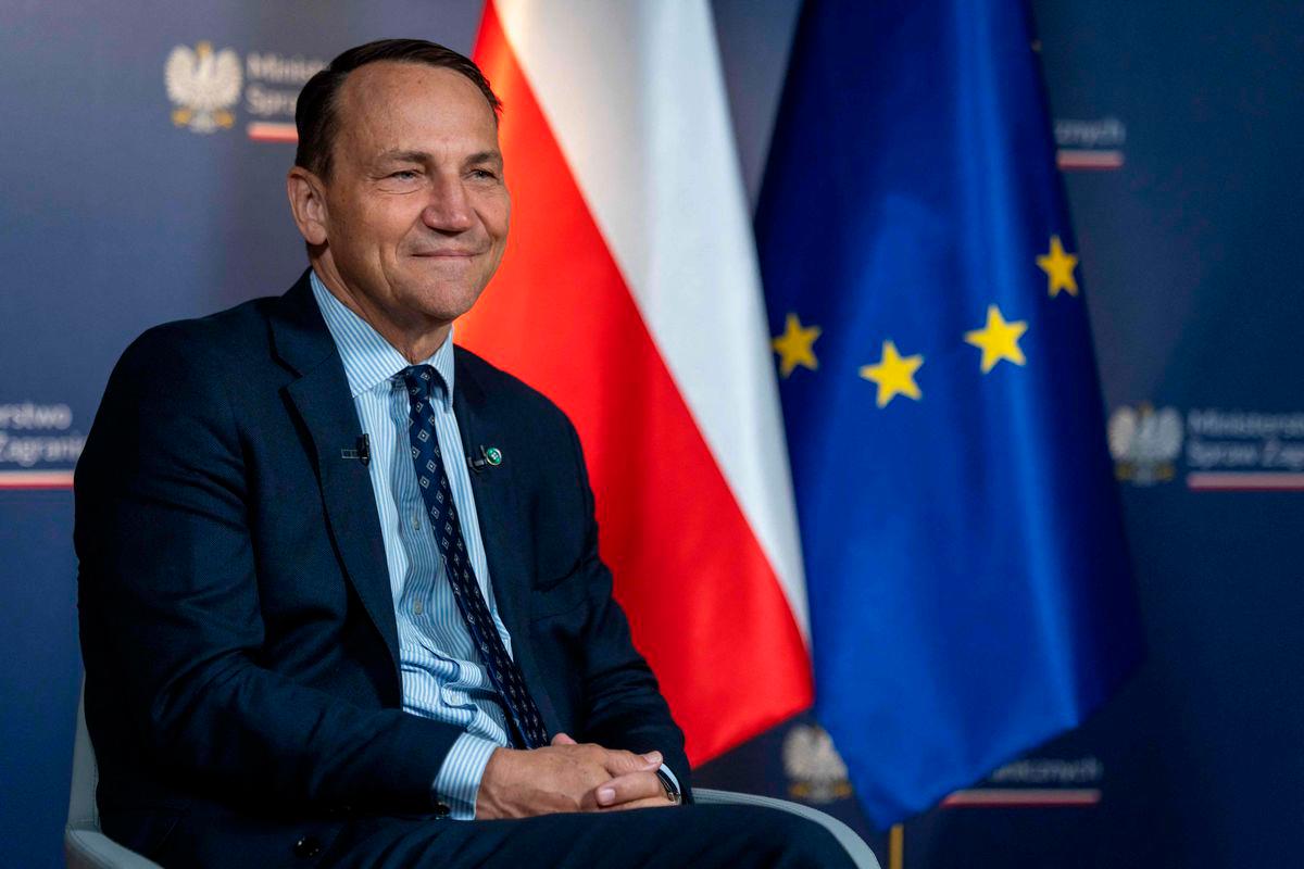 Poland’s Minister of Foreign Affairs Radoslaw Sikorski smiles during the interview for Agence France Presse, Polish Press Agency (PAP) and German Press Agency (DPA) at ministry building in Warsaw on June 26, 2025. (Photo by Wojtek RADWANSKI / AFP)