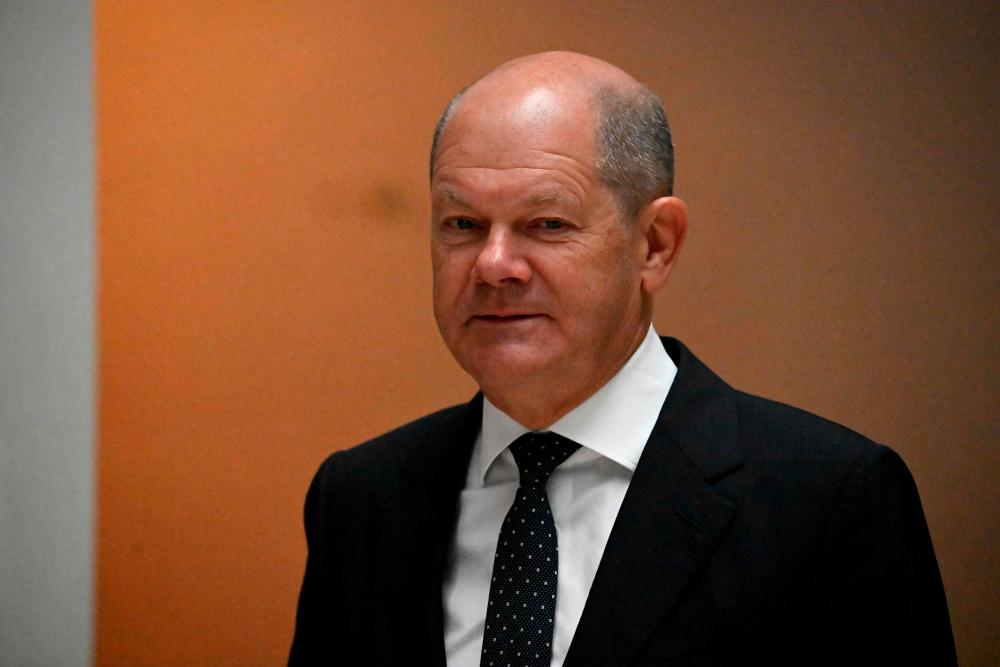 German Chancellor Olaf Scholz arrives for a meeting with the leader of the Italian Democratic Party (PD) upon his visit at the German Social Democratic party (SPD) headquarters in Berlin on September 19, 2022. - AFPPIX