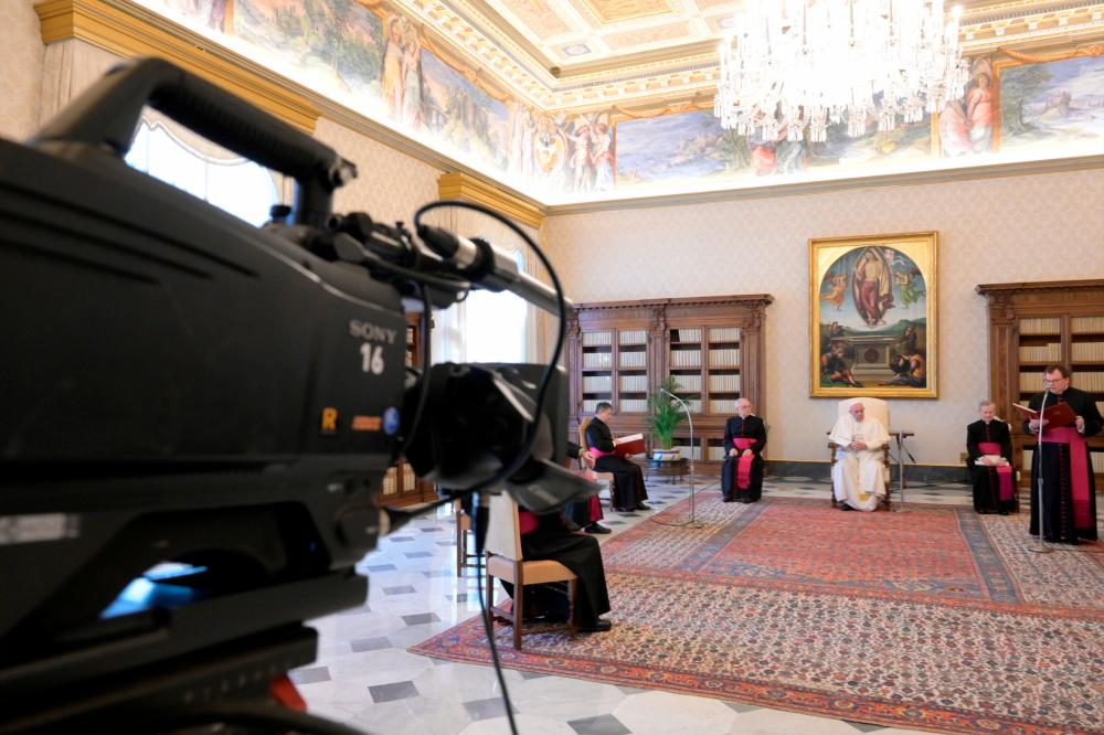 Pope Francis speaks during his general audience as it is streamed via video over the internet from a library as part of measures to contain the coronavirus disease (Covid-19) at the Vatican, April 8, 2020. - Rueuters