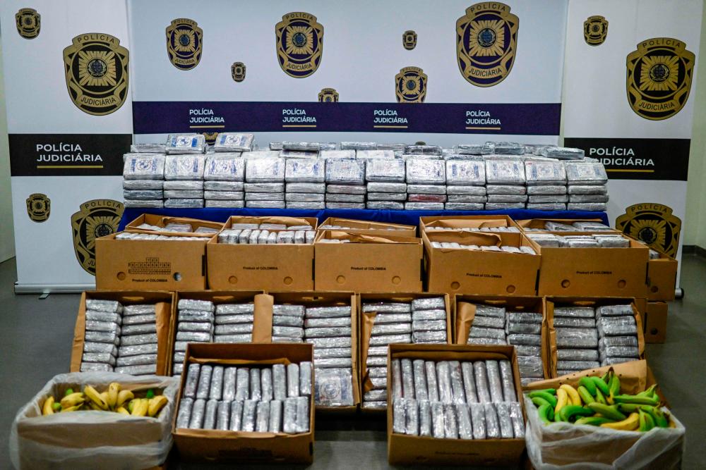 This photograph taken on May 2, 2023 at the Policia Judiciaria - PJ (Criminal Police) headquarters in Lisbon shows banana commercial boxes from Latin America containing 4,2 tones of cocaine seized by Portuguese authorities in the last weeks during an investigation. AFPPIX