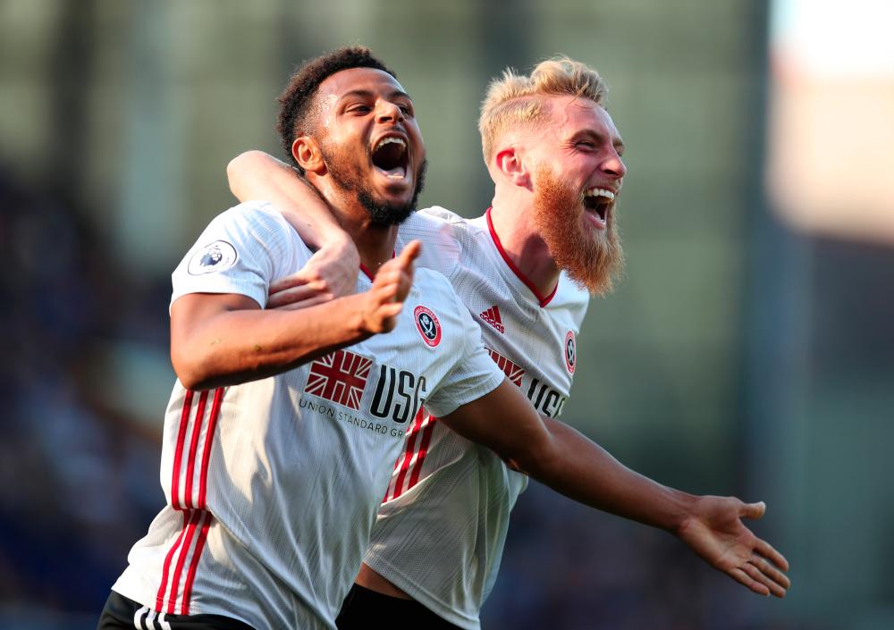 Sheffield United's Lys Mousset celebrates scoring their second goal with Oliver McBurnie. - Reuters