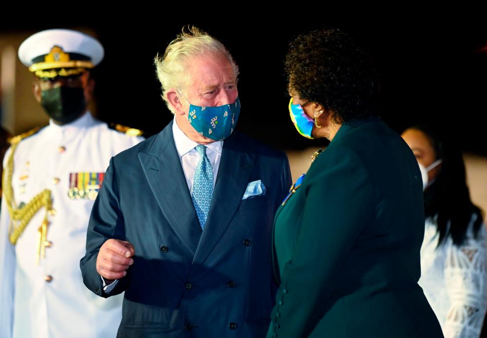 Britain's Prince Charles speaks with Barbados' President-elect Sandra Mason as he arrives at Grantley Adams Airport to take part in events to mark the Caribbean island's transition to a birth of a new republic, Bridgetown, Barbados, November 28, 2021. REUTERSPix