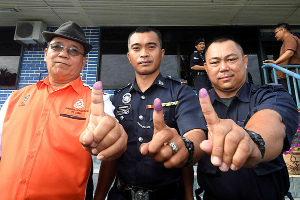 Filepix taken on Jan 14 shows early voters after casting their votes for the Kimanis by-election at the Membakut Police Station. — Bernama
