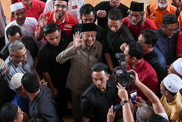 Prime Minister Tun Dr Mahathir Mohamad, who is also PH chairman, waves to supporters after performing Friday prayers at the Sultan Haji Ahmad Shah Mosque on Sungai Koyan Square, Kuala Lipis on Jan 25, 2019. — Bernama