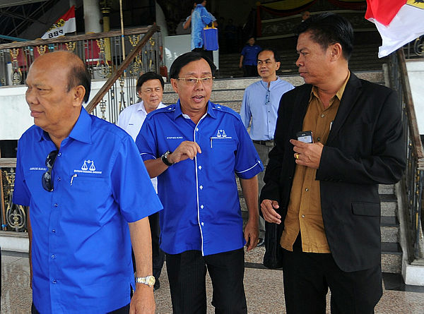 Filepix shows Datuk Seri Dr Stephen Rundi Utom (center) at the Parti Pesaka Bumiputera Bersatu (PBB) main office on April 21.
