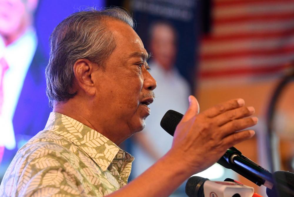 I AM STILL THE PRIME MINISTER... Prime Minister Tan Sri Muhyiddin Yassin addressing his speech at a gathering at Hilltop Luyang yesterday. — Bernama