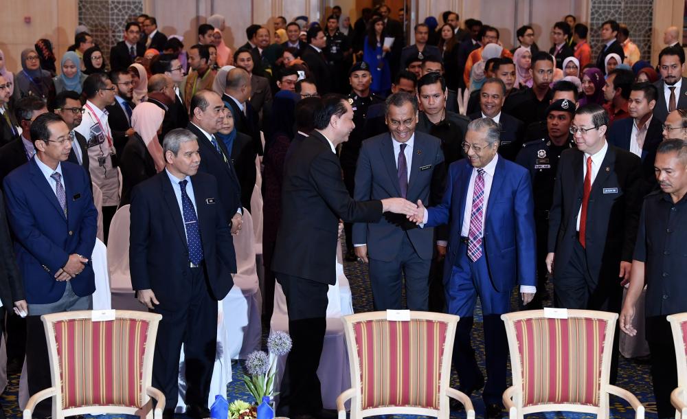 Prime Minister Tun Dr Mahathir Mohamad greets the guests at the launch of the B40 mySalam National Protection Scheme in Malaysia’s Treasury, Ministry of Finance, on Jan 24, 2018. — Bernama