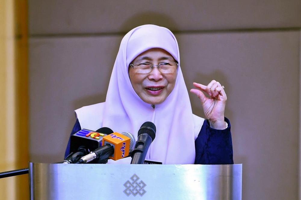 Deputy Prime Minister Datuk Seri Dr Wan Azizah Wan Ismail, who is also the Minister of Women, Family and Community Development, delivers a speech at the launch of the World Bank report titled 'Breaking Barriers: Towards Better Economic Opportunities for Women in Malaysia' today. - Bernama