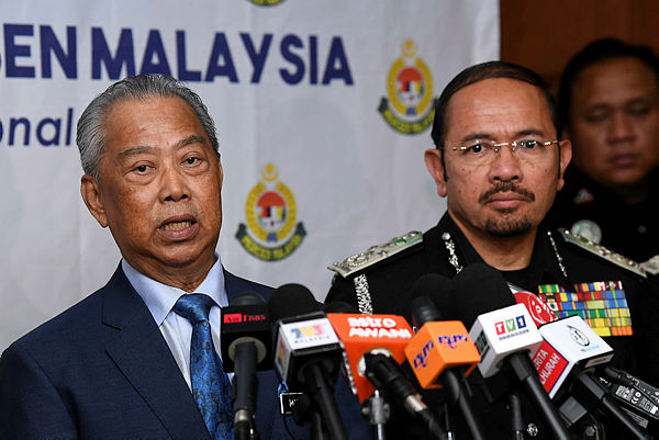 Home Minister Tan Sri Muhyiddin Yassin speaks at a press conference after officiating the Immigration Day 2018 celebration at the Immigration Department on Dec 20, 2018. Also present was Immigration Director-General Datuk Seri Mustafar Ali. — Bernama