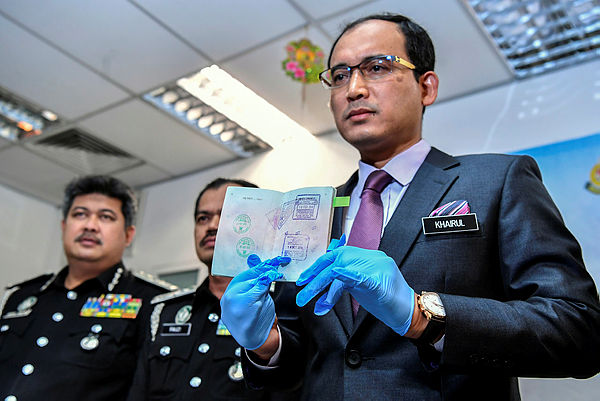 Filepix taken on July 19 shows Immigration Department director-general Datuk Khairul Dzaimee Daud (right) at a press conference in Putrajaya. — Bernama
