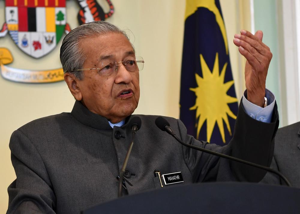 Prime Minister Tun Dr Mahathir Mohamad speaks during a press conference after chairing the Economic Action Council (EAC) meeting at Perdana Putra today. - Bernama