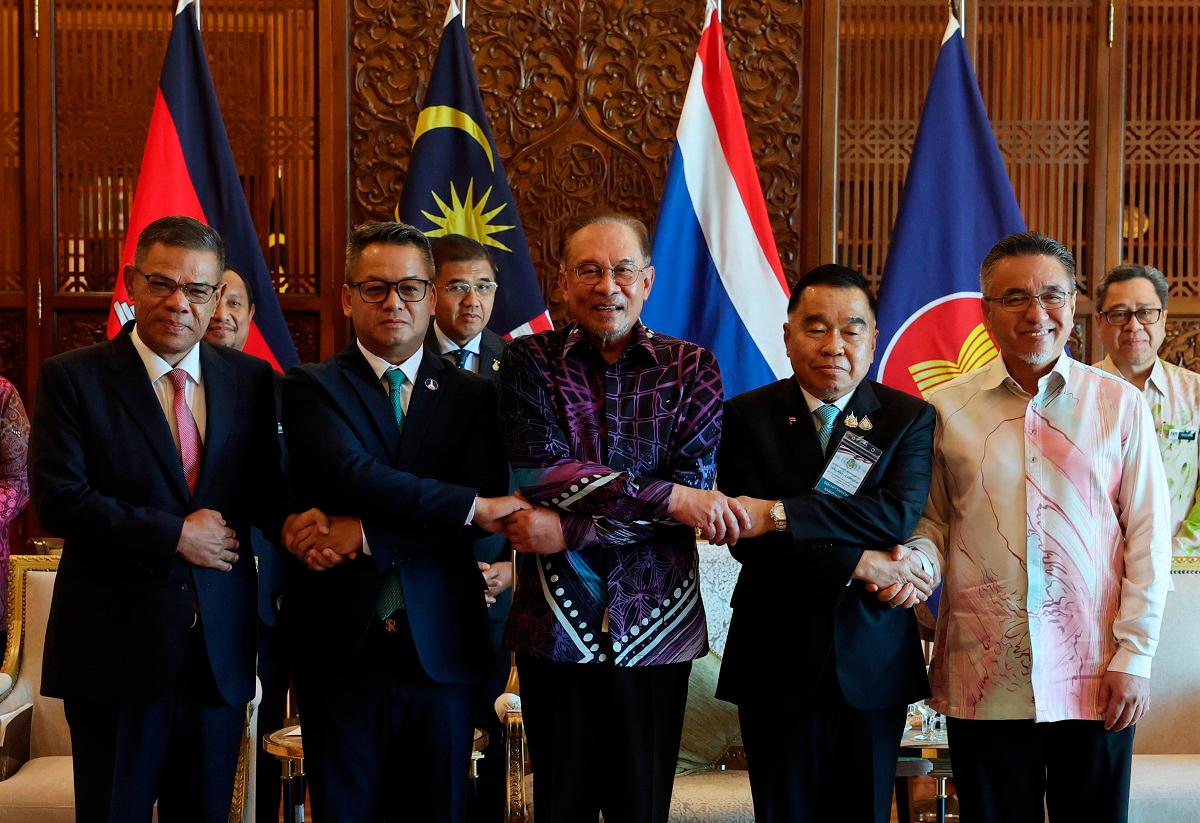 Anwar with (from left) Home Minister Datuk Seri Saifuddin Nasution Ismail, Cambodian Deputy Prime Minister Gen Tea Seiha, Thai Acting Defence Minister Gen Natthaphon Narkphanit and Defence Deputy Minister Adly Zahari at the Perdana Putra Building yesterday. – BERNAMApix
