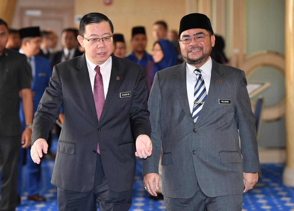 Finance Minister Lim Guan Eng with Minister in the Prime Minister’s Department Datuk Seri Mujahid Yusof Rawa leaves after the he handing over of RM25 million in allocation under the 2019 Budget for registered pondok schools, on Jan 8, 2018. — Bernama