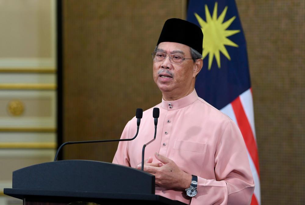 Perdana Menteri Tan Sri Muhyiddin Yassin ketika menyampaikan perutusan khas yang disiarkan di stesen-stesen televisyen tempatan, hari ini.  — Bernama  