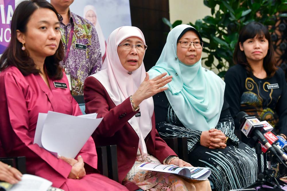 Deputy Prime Minister and Minister of Women, Family and Community Development, Datuk Seri Dr Wan Azizah Wan Ismail (2nd from L) speaks at a press conference after launching the National Strategic Plan to Address the Causes of Underage Marriage today. - Bernama