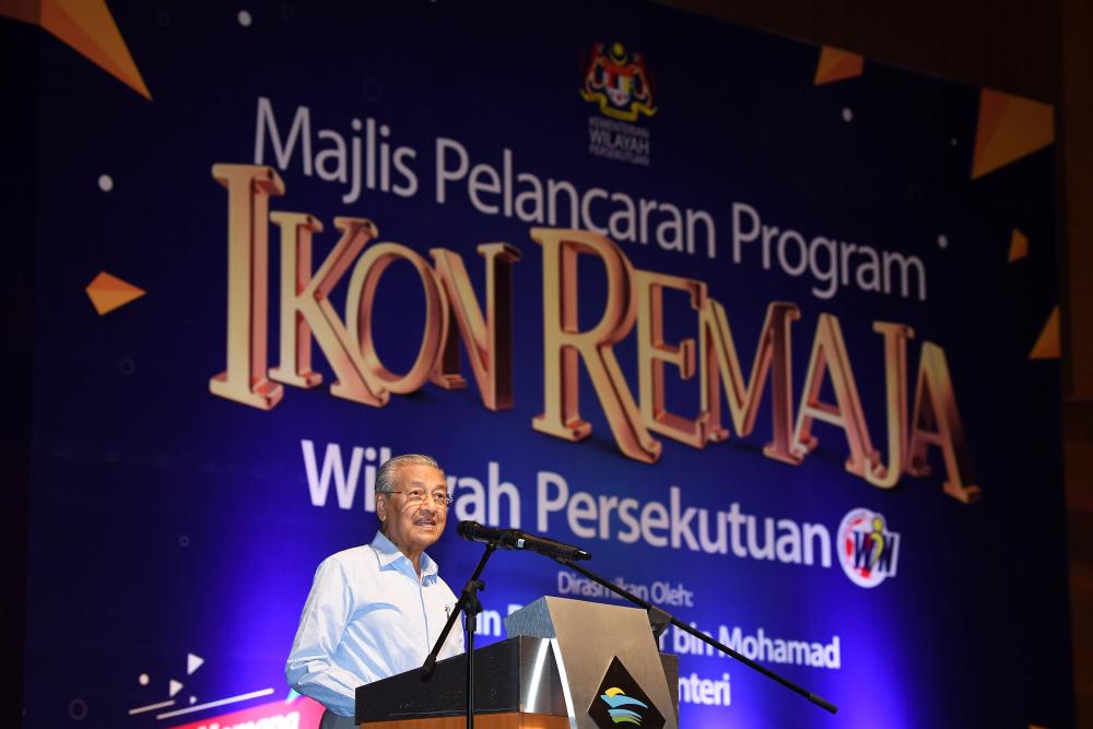 Prime Minister Tun Dr Mahathir Mohamad delivers a speech during the Launching Ceremony of the Federal Territories Youth Advisory Program at the Putrajaya International Convention Centre, on March 16, 2019. — Bernama