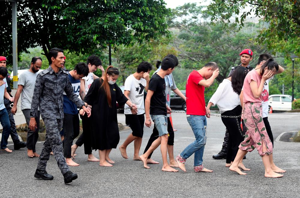 A total of 152 Chinese nationals and a Bangladeshi man detained in an immigration bust on suspected online cheating operations were charged in the sessions court here today for immigration offences. — Bernama