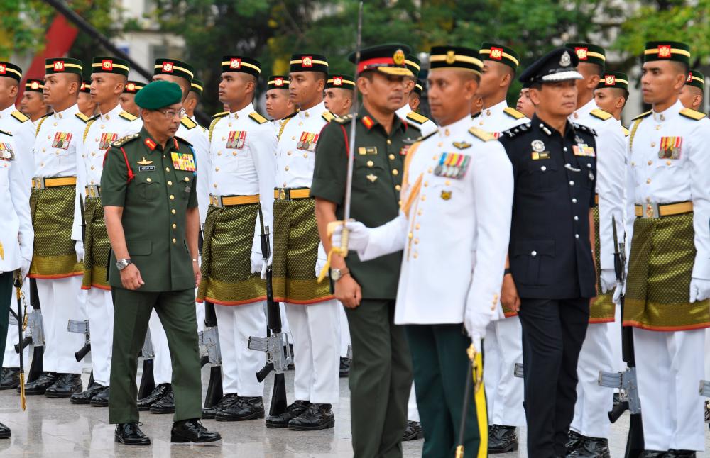 The Yang di-Pertuan Agong Al-Sultan Abdullah Ri’ayatuddin Al-Mustafa Billah Shah inspects a guard of honour, after arriving for the 62nd National Day celebrations, in Putrajaya, on Aug 31, 2019. — Bernama