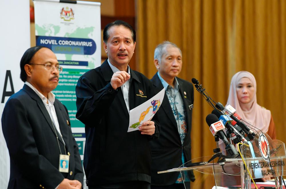 Health director-General Datuk Dr Noor Hisham Abdullah (2L) during a press conference regarding Covid-19 in Ministry of Health yesterday. - Bernama
