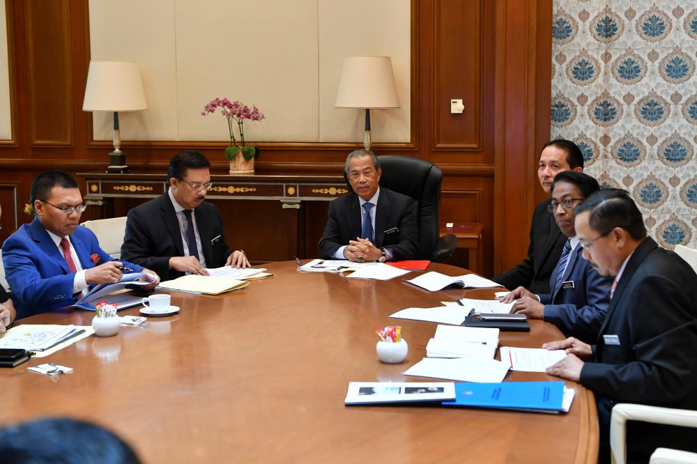 Prime Minister Tan Sri Muhyiddin Yassin receives a briefing on the Covid-19 status by the Ministry of Health’s Special Task Force at the Prime Minister’s Office today. - Bernama