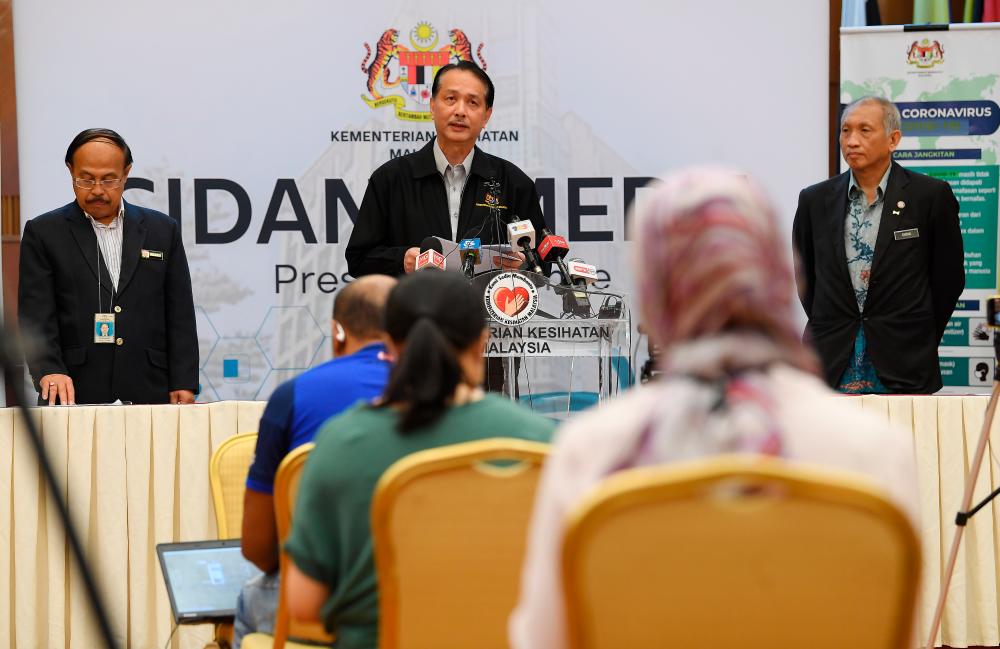 Health Ministry director-general Datuk Dr Noor Hisham Abdullah (C) at the daily media conference on Covid-19 infections at the Ministry of Health today. - Bernama