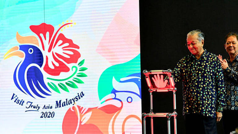 Prime Minister Tun Dr Mahathir Mohamad during the launch of the new Visit Malaysia 2020 campaign logo at KLIA on July 22, 2019. — Bernama