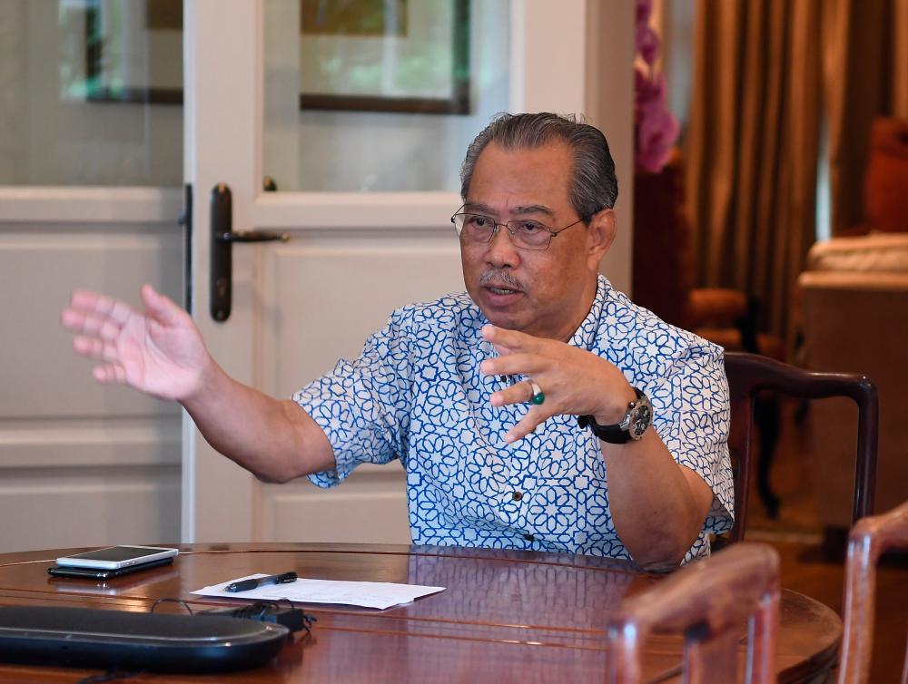 Prime minister Tan Sri Muhyiddin Yassin talks during a 40-minute video conferencing with Senior Minister (Security Cluster) Datuk Seri Ismail Sabri Yaakob and Health director-general Datuk Dr Noor Hisham Abdullah yesterday. — Bernama