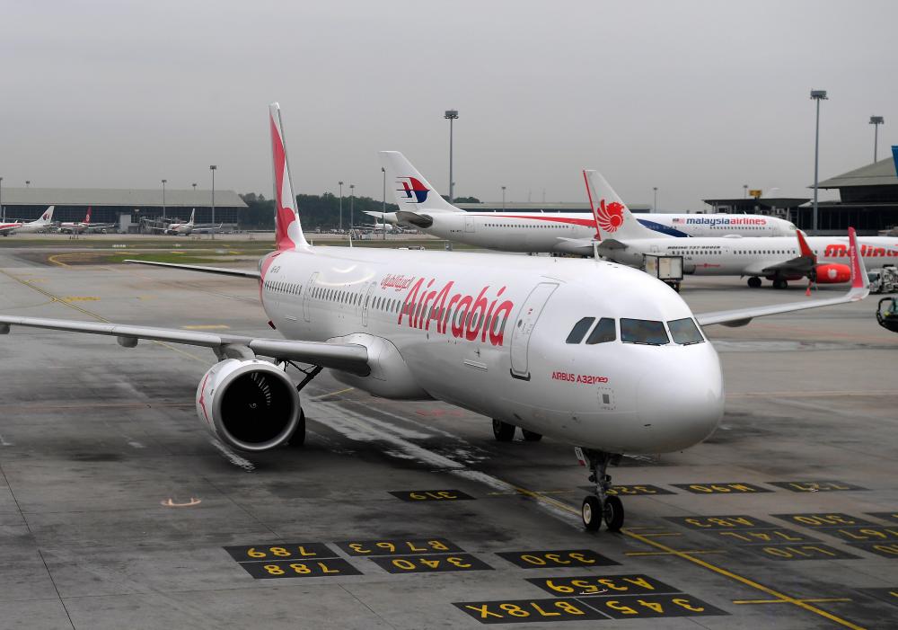 An Air Arabia plane landed safely today during the reception of the first flight in the Sharjah, UAE to Kuala Lumpur route, at the Kuala Lumpur International Airport (KLIA) today. - Bernama