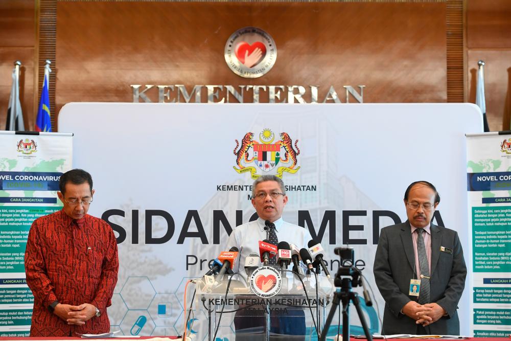 Health Minister Datuk Seri Dr Adham Baba (C) gives a press conference on the latest developments in the Covid-19 outbreak at the Health Ministry today. - Bernama