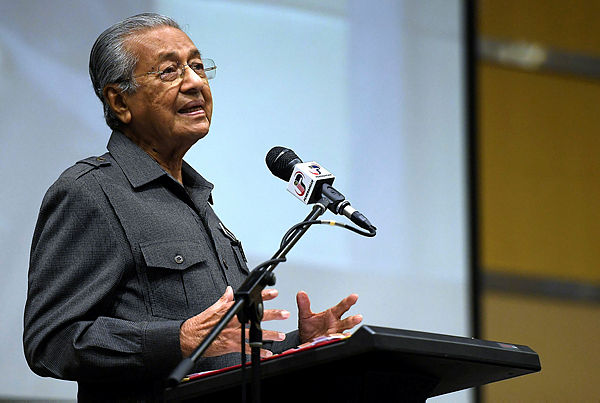 Prime Minister Tun Dr Mahathir Mohamad speaking at the second session of his meeting with senior government officials for 2019 in Putrajaya Corporation Complex today. — Bernama