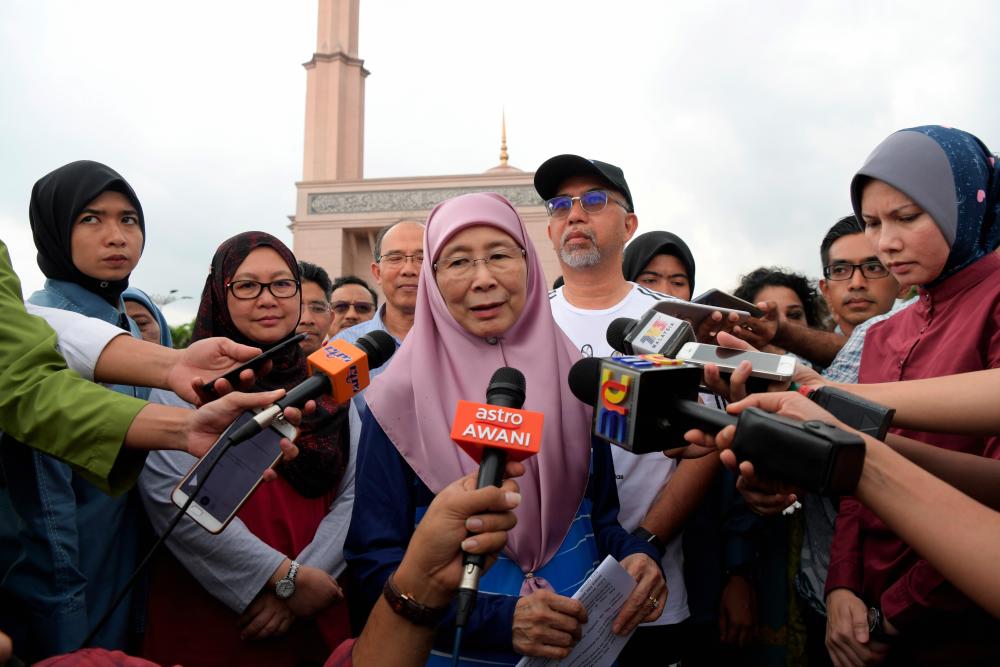 Deputy Prime Minister Datuk Seri Dr Wan Azizah Wan Ismail speaks to reporters after attending the ‘Brisk Walk’ programme at the Putra Mosque grounds, Putrajaya on June 21, 2019. - Bernama
