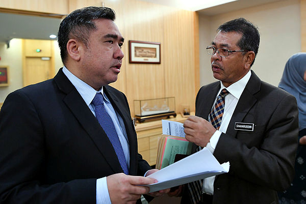 Transport Minister Anthony Loke (left) at a press conference held in his ministry today. — Bernama