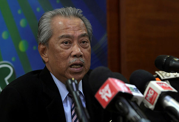 Home Minister Tan Sri Muhyiddin Yassin at a press conference in the Immigration department today.