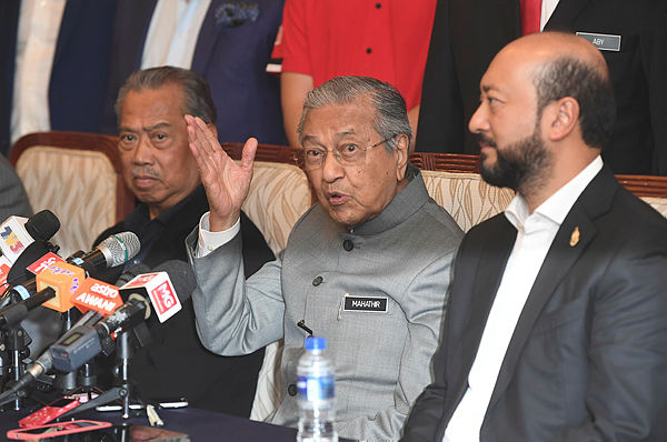 Bersatu chairman Tun Dr Mahathir Mohamad (centre) speaking at a media conference after chairing the Bersatu Supreme Council meeting yesterday. — Bernama