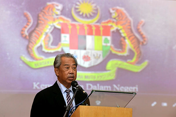 Home Minister Tan Sri Muhyiddin Yassin speaking at Putrajaya today. — Bernama