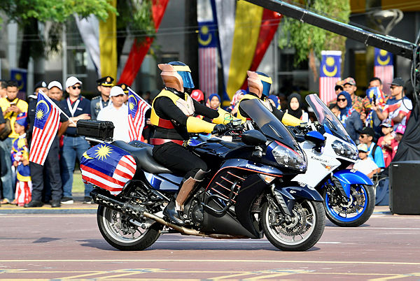 The high performance motorcycle team dressed in Captain MACC costumes at the National Day parade in Dataran Putrajaya today. — Bernama