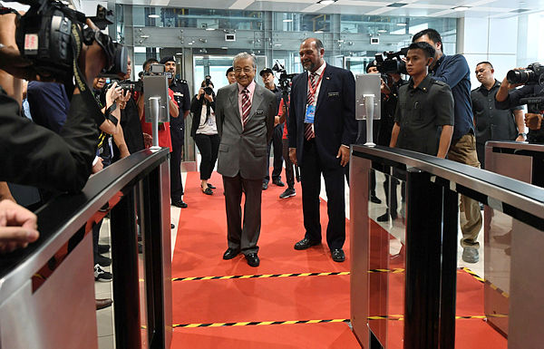 Prime Minister Tun Dr Mahathir and Communications and Multimedia Minister Gobind Singh Deo attend the launching of the 5G Malaysia showcase in Putrajaya on April 18, 2019. — Bernama