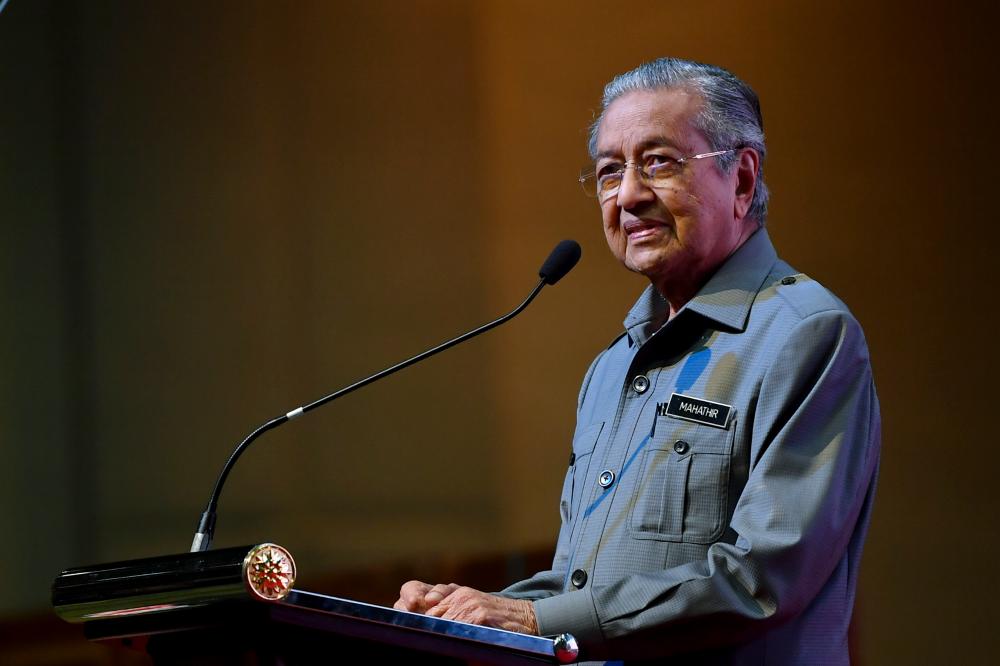 Prime Minister Tun Dr Mahathir Mohamad delivers a speech during a friendly meeting with the Ministry of Rural Development at the Putrajaya International Convention Centre today. - Bernama