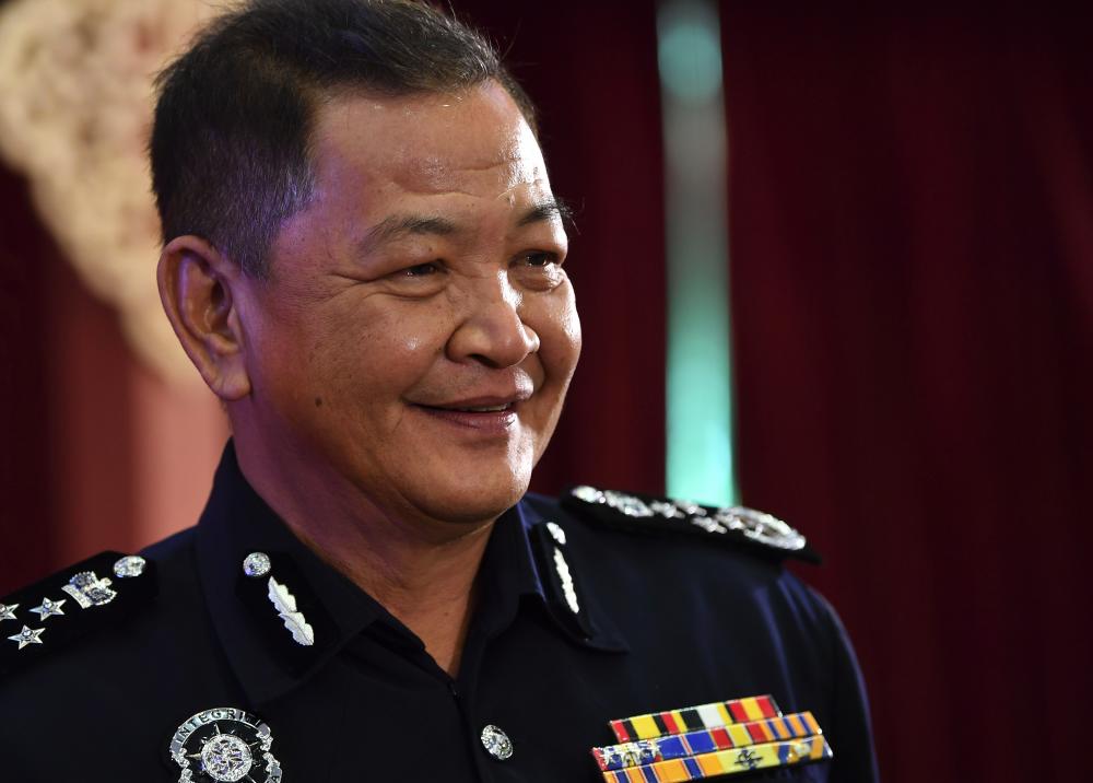 Inspector-General of Police Datuk Seri Abdul Hamid Bador is interviewed by reporters during the Hari Raya Aidilfitri celebration of the Ministry of Agriculture and Agro-Based Industry on June 13, 2019. - Bernama