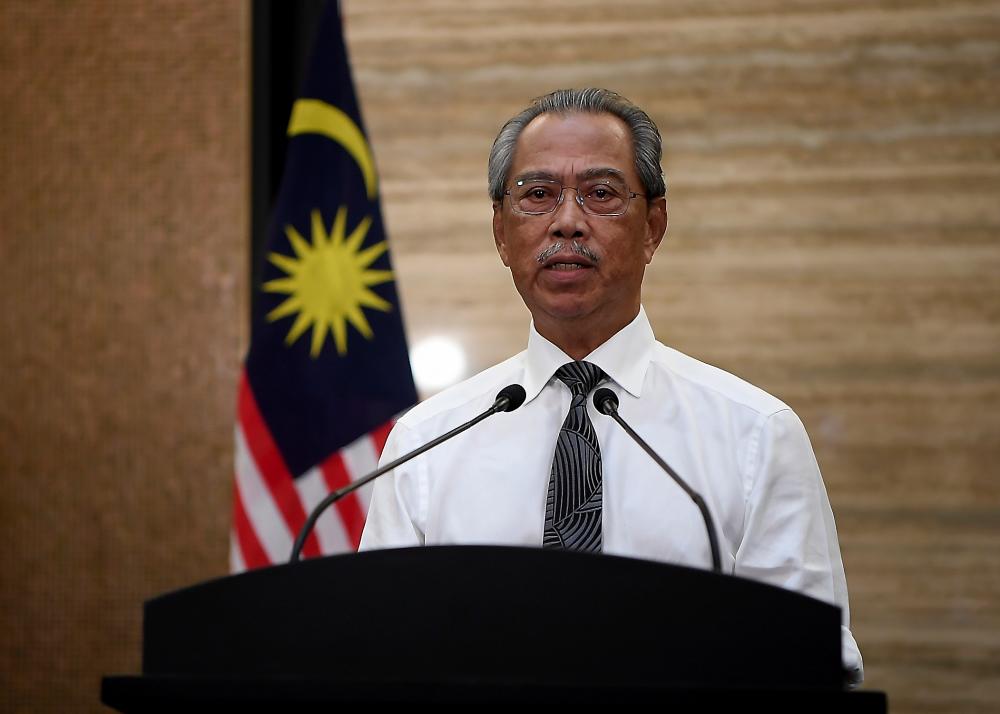 Prime Minister Tan Sri Muhyiddin Yassin delivers his Covid-19 special address that aired live on all television channels and social media platforms tonight.  - Bernama