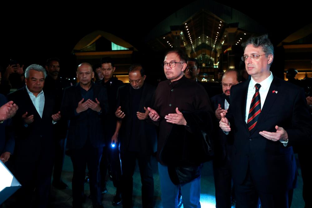 SEPANG, Feb 14 -- Prime Minister Datuk Seri Anwar Ibrahim prayed at the Flower Complex of the Kuala Lumpur International Airport (KLIA) before departing for Turkey to express moral support to President Recep Tayyip Erdogan and the people of the country who were hit by the earthquake earlier last week. until sacrificing tens of thousands of lives. BERNAMAPIX