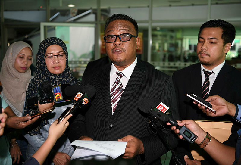 Filepix of Puan Sri Sabariah Mohd Shariff (2nd L) with her lawyer Mohd Khairul Azam Abdul Aziz. — Bernama