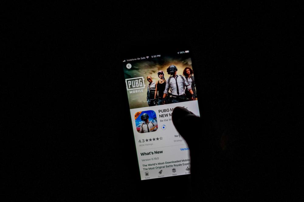 A man looks at the ‘PUBG Mobile’ game, owned by Tencent, in the App Store on an Apple iPhone in New Delhi on Sept 2, 2020. – AFPPIX