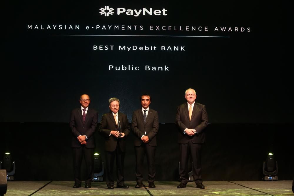 From left: PayNet chairman Datuk Ahmad Hizzad, Tay, Adnan Zaylani and PayNet Group CEO Peter Schiesser.
